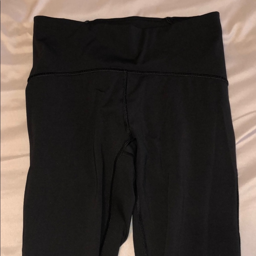Authentic Black Lulu Leggings With Mesh on Legs